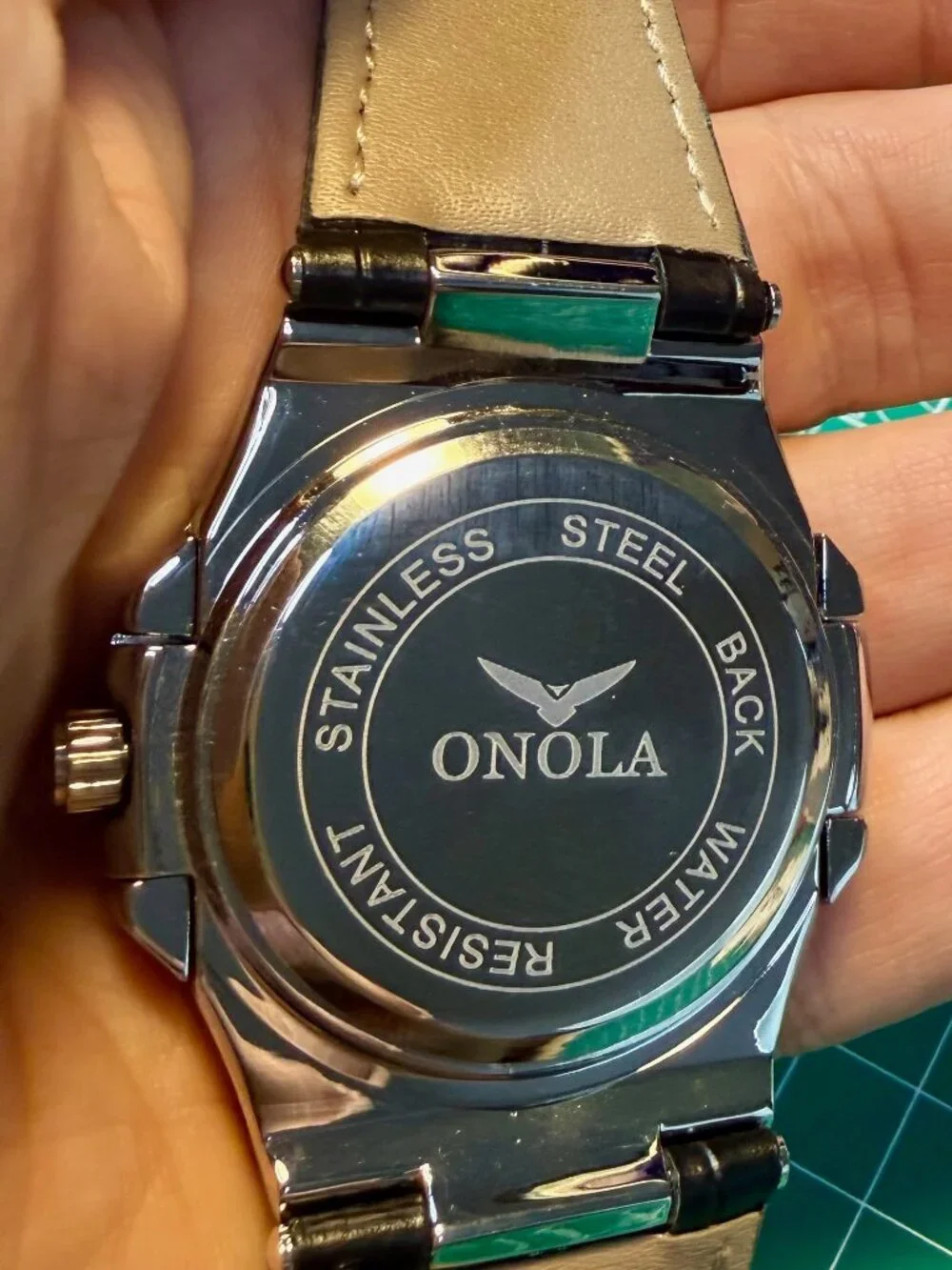 Onola quartz men's watch silver and black leather strap. Rainbow Gems Bezel.